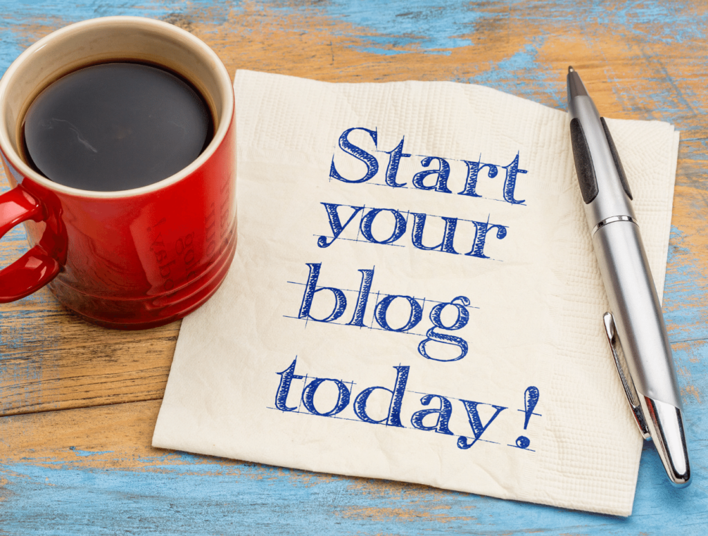 Cup of coffee on a napkin that says "Start your blog today!"